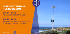 Imagem de poste com sirene em fundo de praia. Informação adicional "O Serviço Municipal de Proteção Civil de Cascais irá testar o som das sirenes de alerta de Tsunami, nos dias 24 e 25 de julho às 09h30. No dia 24, o teste ocorrerá na Praia de Carcavelos e no dia 25 o teste acontece nas Praias da Parede, Avencas e São Pedro do Estoril. A duração máxima prevista de cada ensaio é de 5 minutos."